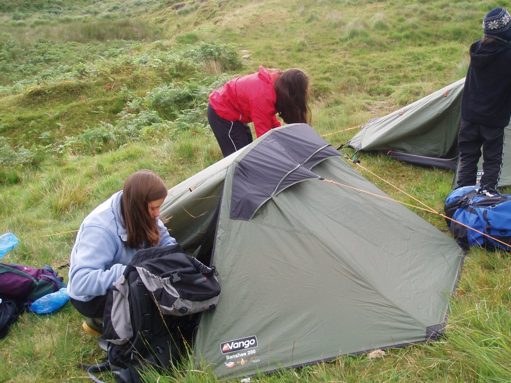 Children setting up a tent